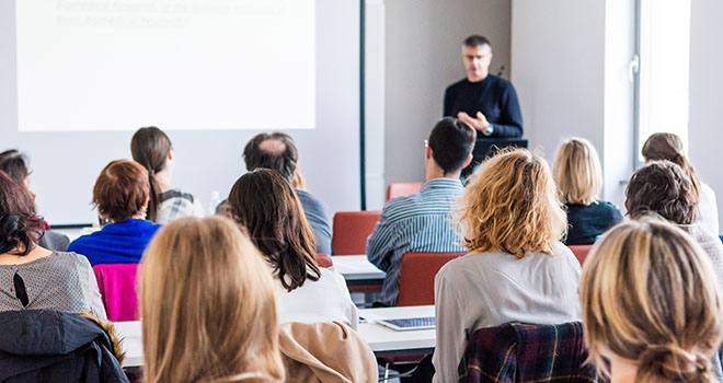 Group of adults learning in a classroom