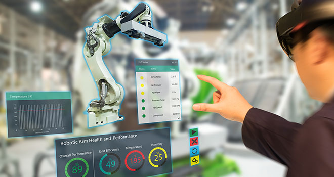 Workers collaborate over a machine in mixed reality