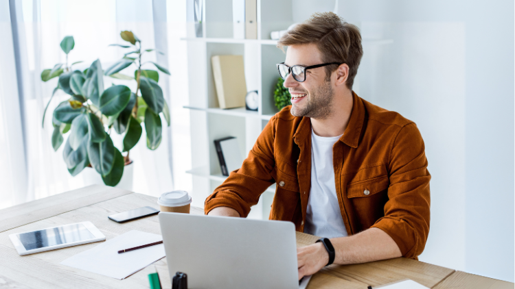 Remote worker in home office looking happy